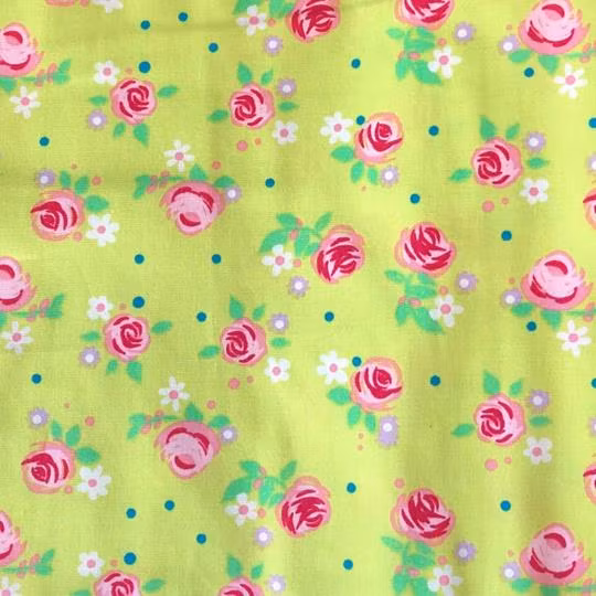 Bomullstyg blommigt lime rosa