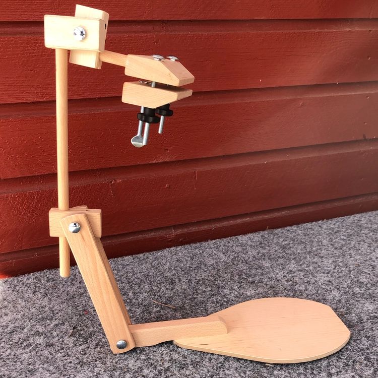 Ställning för sybåge att sitta på