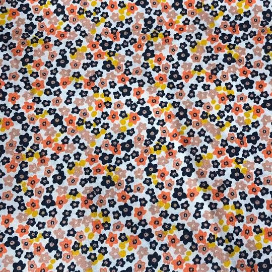 Bomullstyg småblommigt gult svart orange
