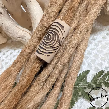 "Djupet" Dreadsmycke i trä med spiral öga