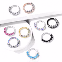 Piercingring med sju stycken ädelstenar