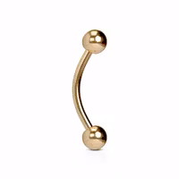Roséguld ögonbrynspiercing med boll
