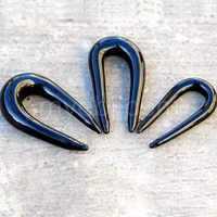 Svart U formad glas taper