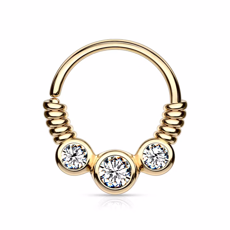 Piercingring snurrad med tre ädelstenar