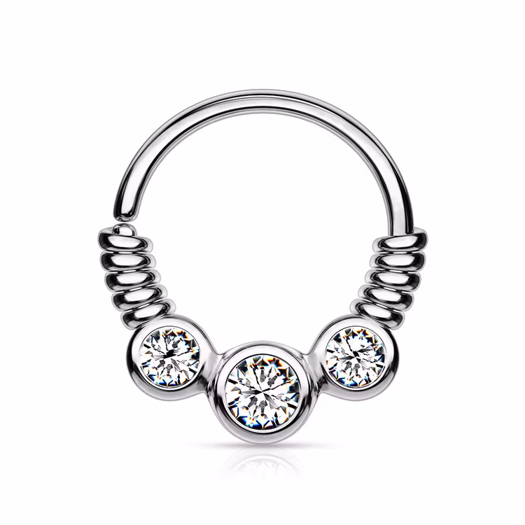 Piercingring snurrad med tre ädelstenar