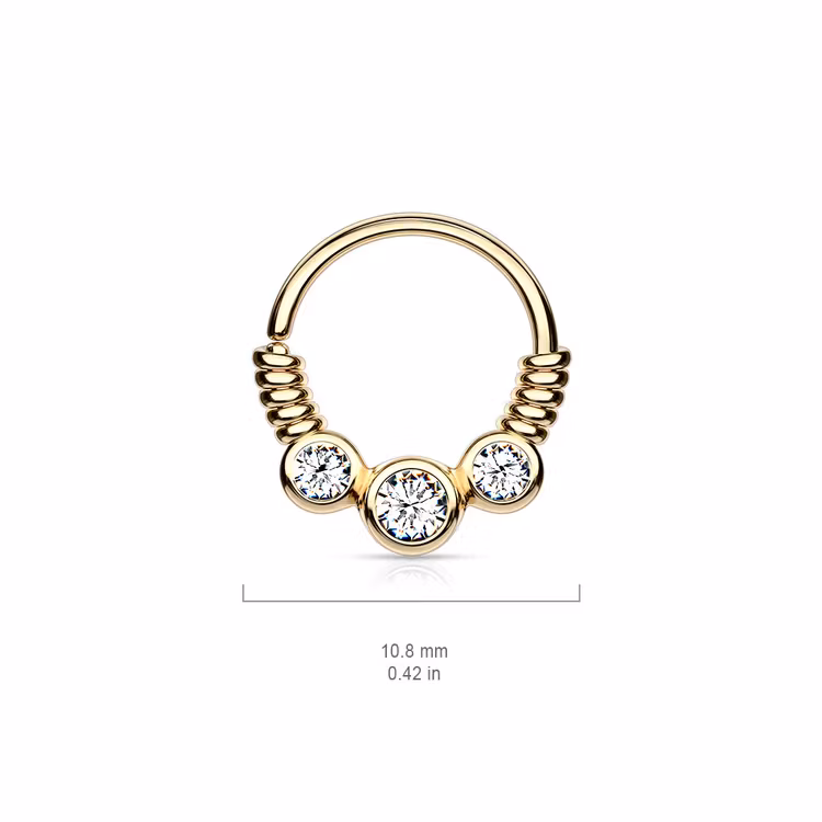 Piercingring snurrad med tre ädelstenar