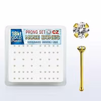 Förpackning med näspiercing i guld.