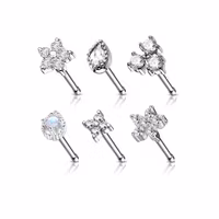 Display med 24 raka näspiercingar