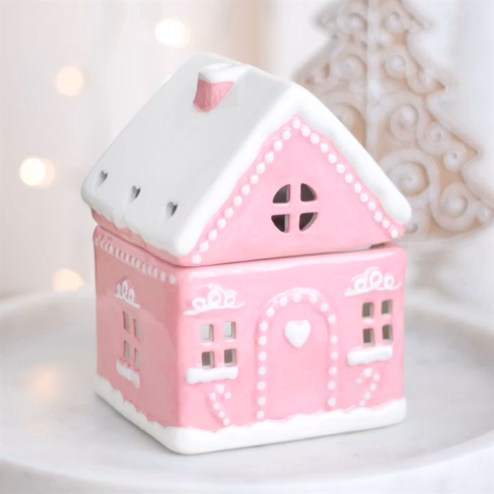 Aromalampa i form av rosa pepparkakshus