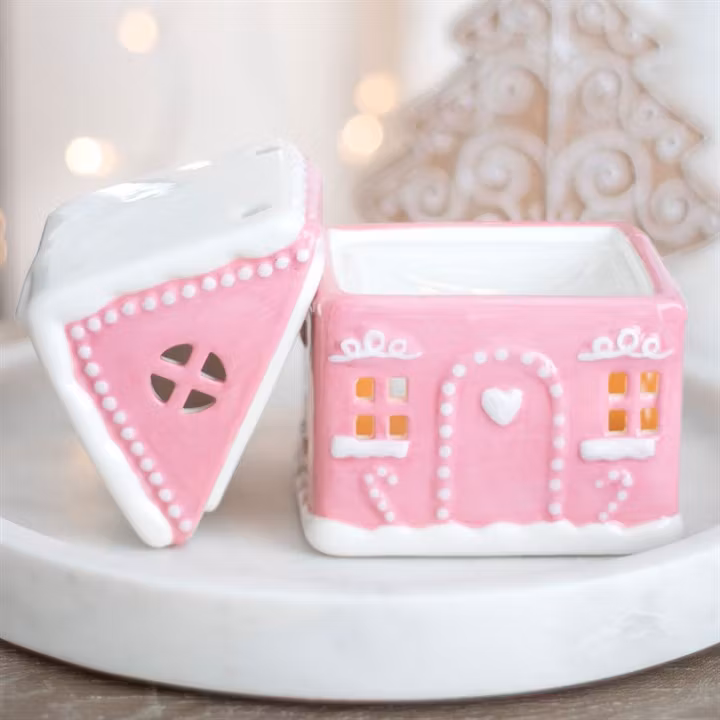 Aromalampa i form av rosa pepparkakshus med locket av