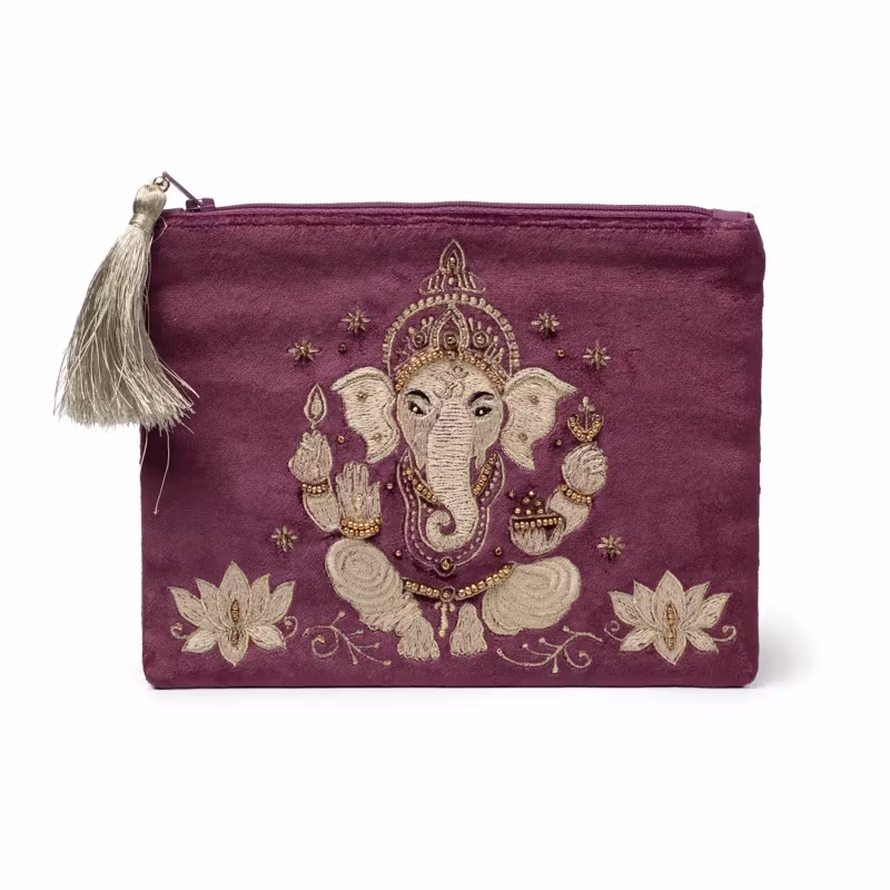 lila/vinröd necessär i sammet med guldfärgat motiv av Ganesha