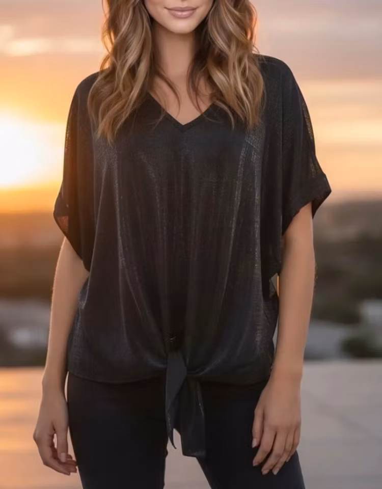 Knytblus skimrande svart