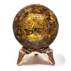 Orgonitboll med tigeröga och livets trädsymbol.