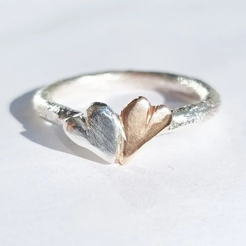 Sparkling and raw silver ring with double hearts, silver and bronze