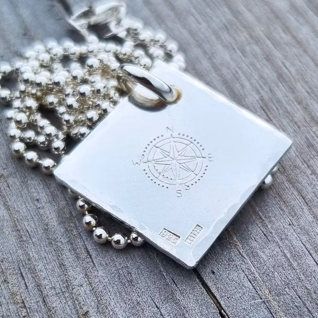Compass rose on a large silver tray in genuine silver