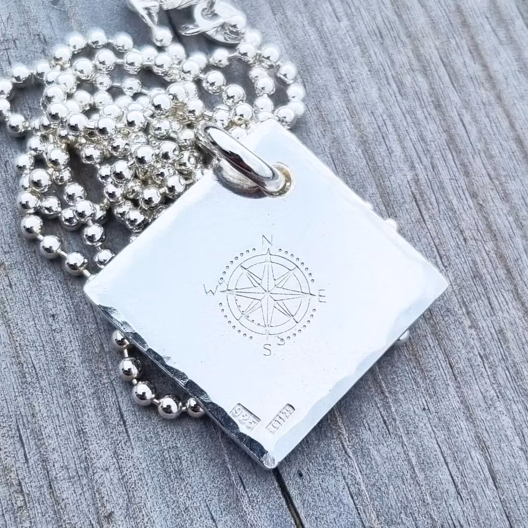 Compass rose on a large silver tray in genuine silver