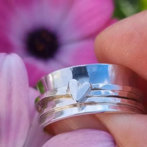 Snurring i äkta silver med handsågat hjärta