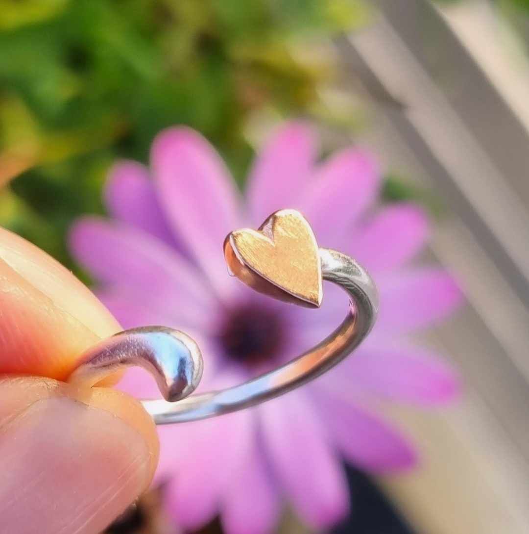Open heart ring in sterling silver with hand-sawn heart in bronze Happy Heart