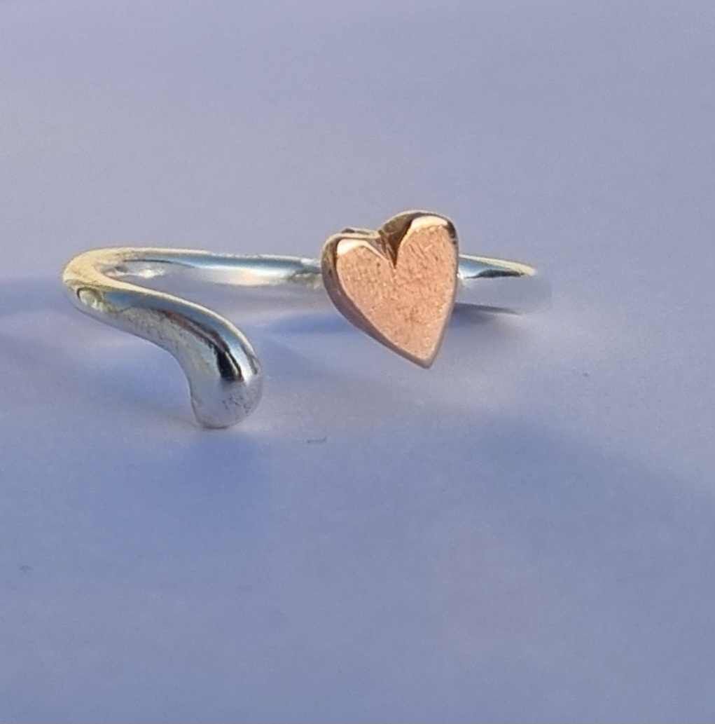 Open heart ring in sterling silver with hand-sawn heart in bronze Happy Heart