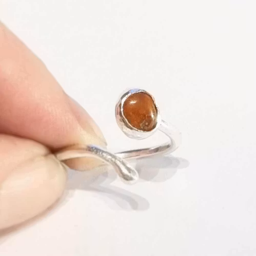 Candy a fine handmade silver ring with a reddish-brown set stone