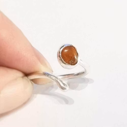 Candy a fine handmade silver ring with a reddish-brown set stone