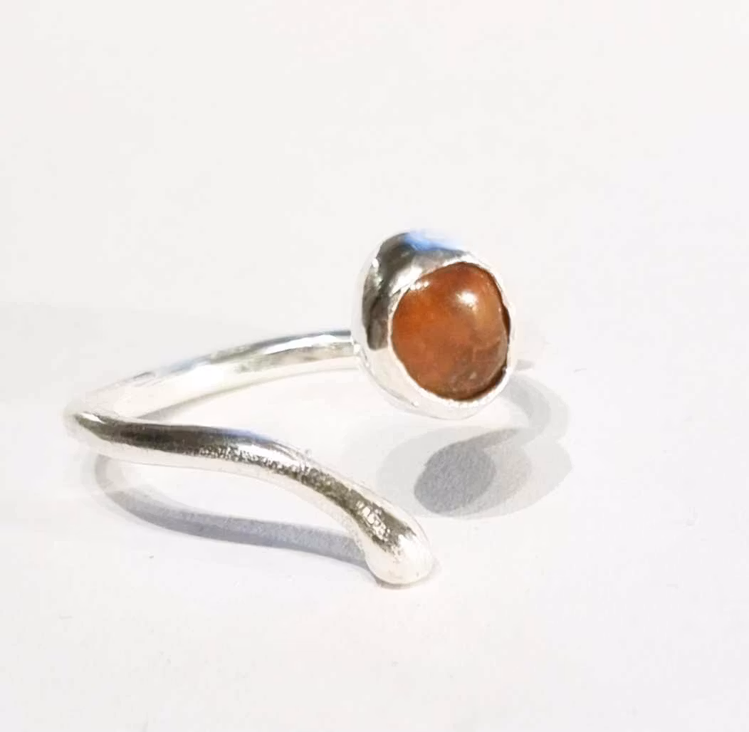 Candy a fine handmade silver ring with a reddish-brown set stone