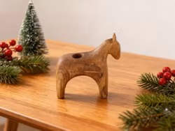Candlestick in the form of a hand-polished wooden horse