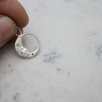 "Mångubbe" i silver med diamantstjärnor