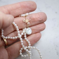 Sötvattenspärlor med guldstjärna och diamanter
