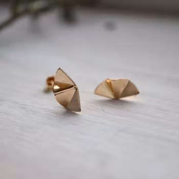 "Stråle" örhängen i rött guld