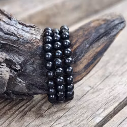 Jet (Fossilerad kolmineral), armband 8mm runda pärlor -30% fyndexemplar trasig pärla