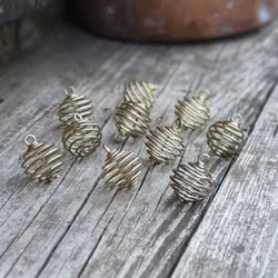 Liten spiralbur för stenar, guld -20% fynd - mörka!