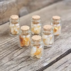 Citrin, små trumlade i glasflaska