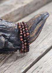 Oxöga, armband 6mm runda pärlor