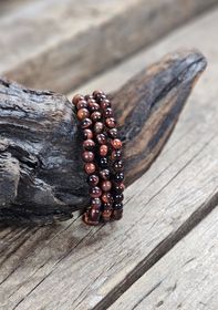 Oxöga, armband 6mm runda pärlor