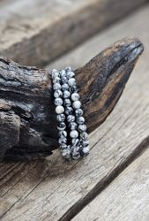 Pinolith, armband 6mm runda pärlor