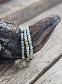Blå/Brun Onyx, armband 5-6mm runda pärlor