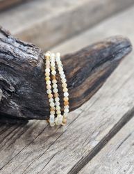 Fire Opal (Eldopal), armband 4mm facetterade pärlor