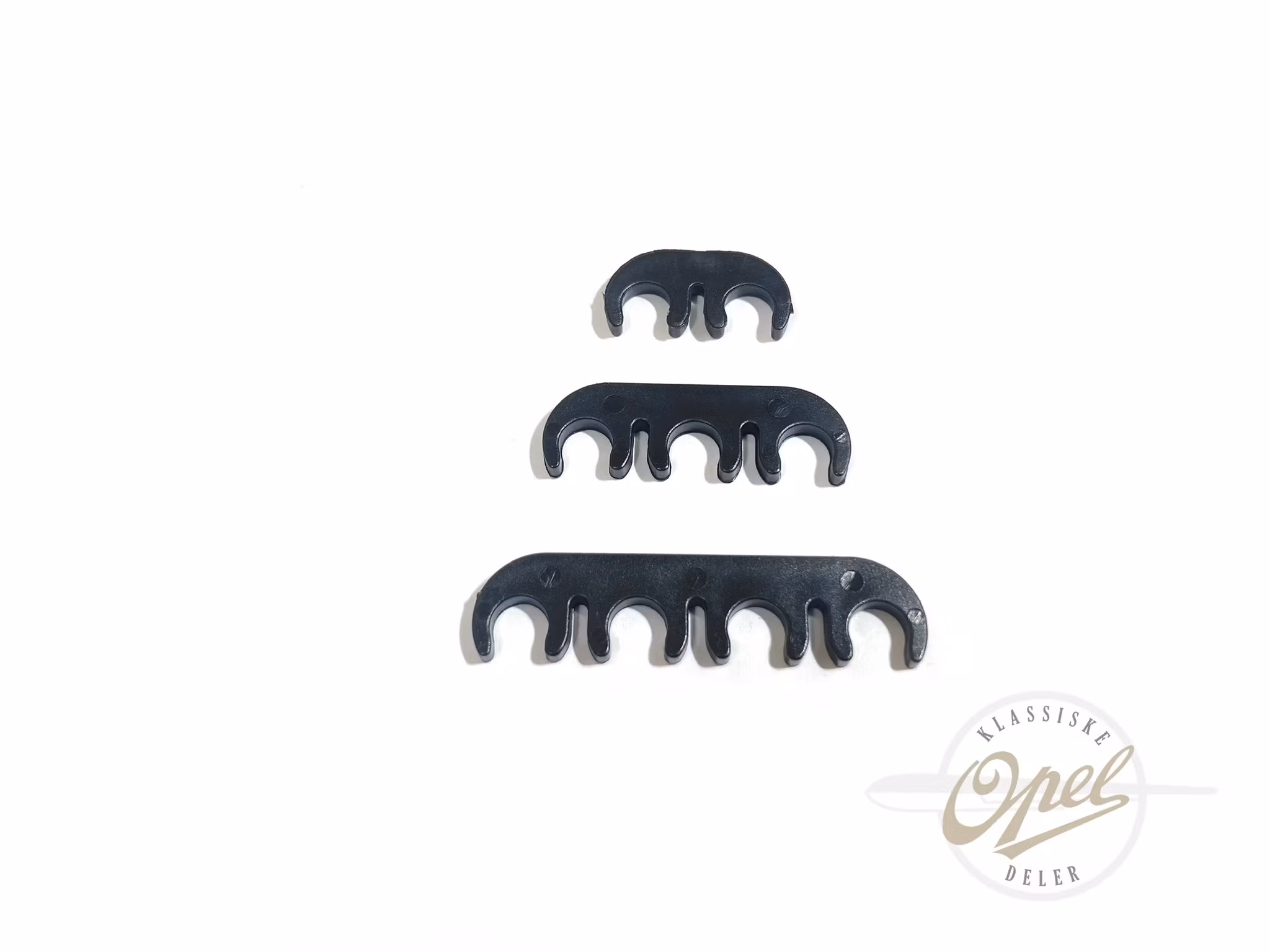 Klammer til tennpluggkabler