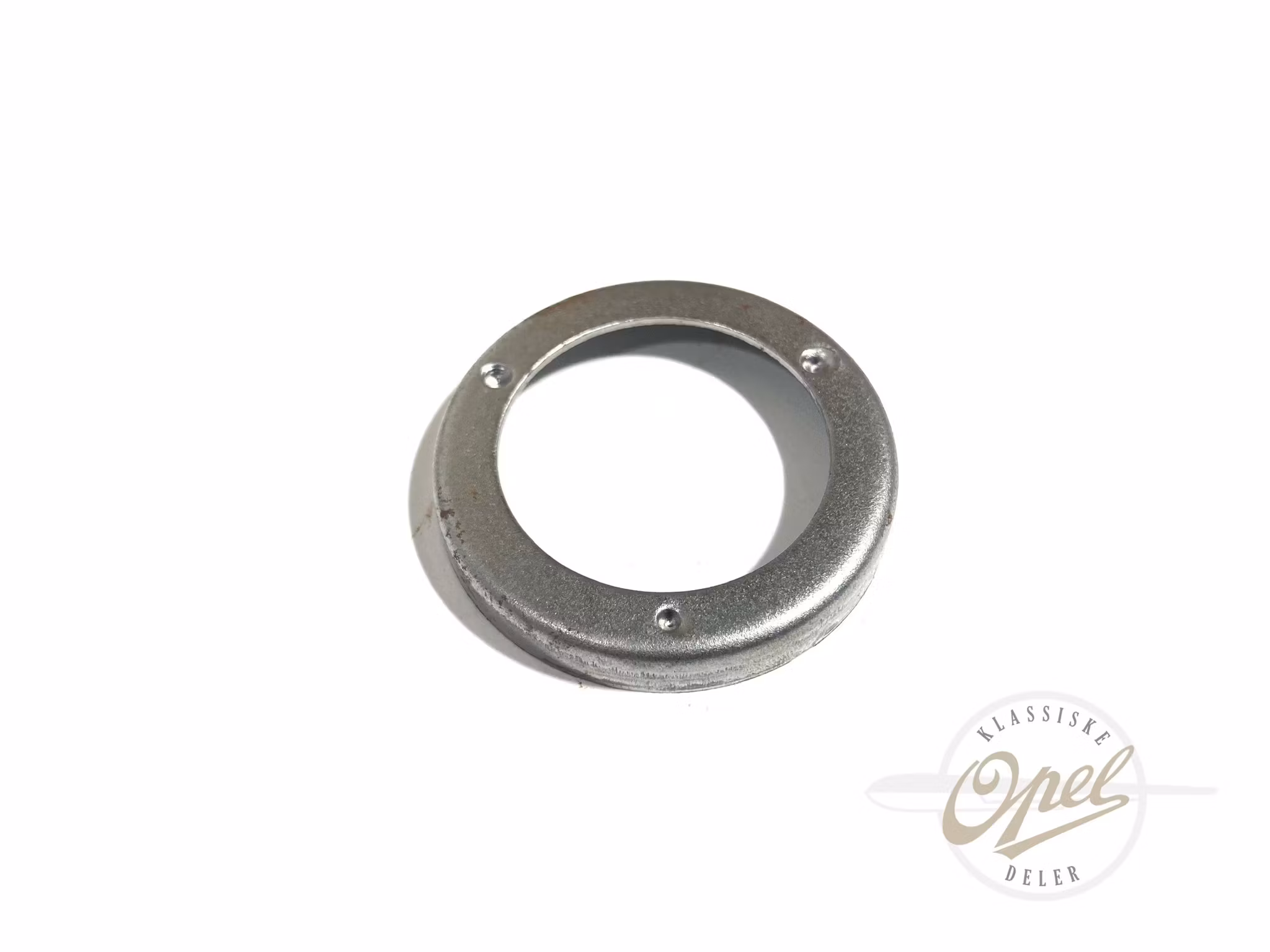 Holder til pakning i registerdeksel