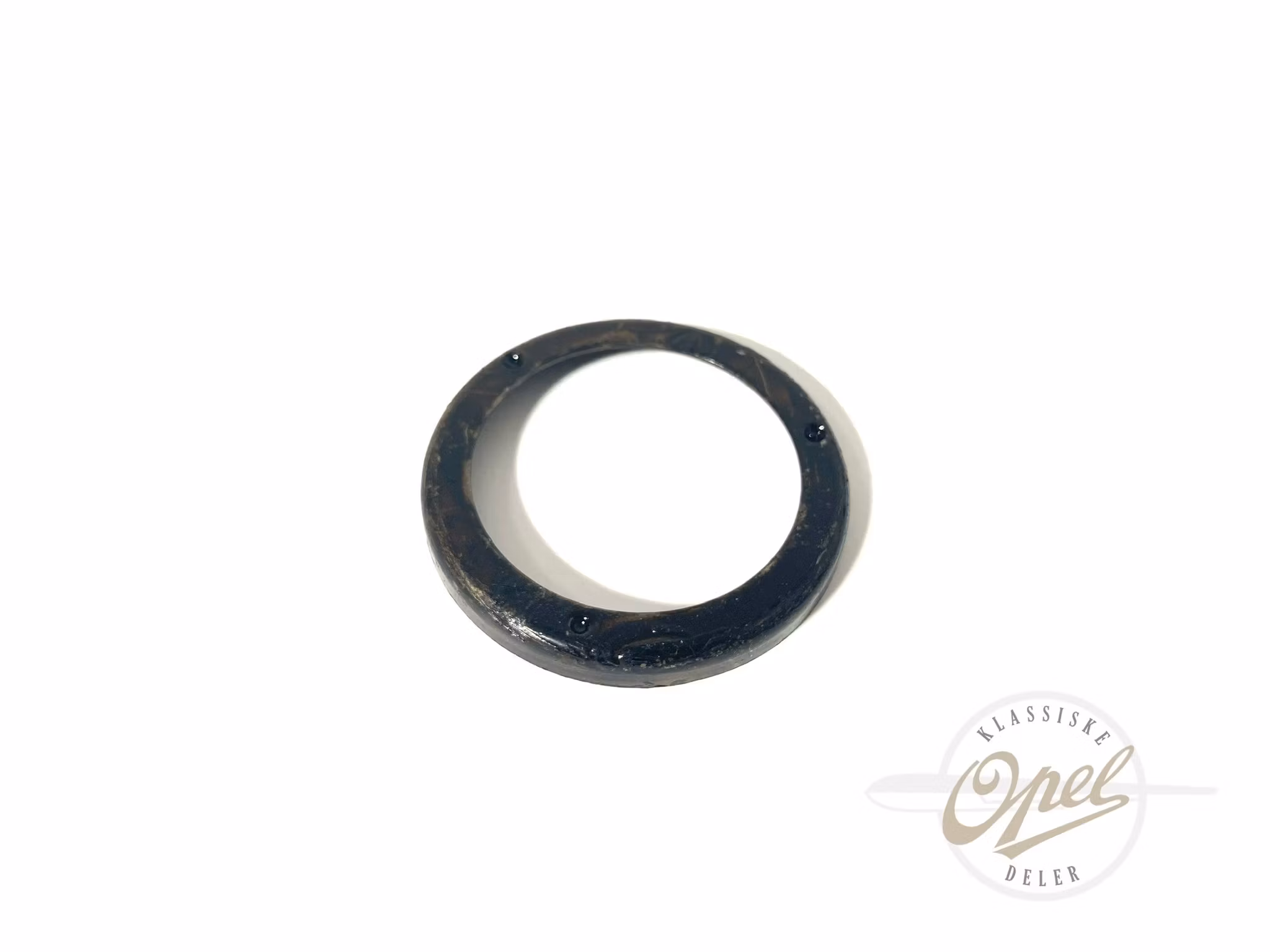 Holder til pakning i registerdeksel