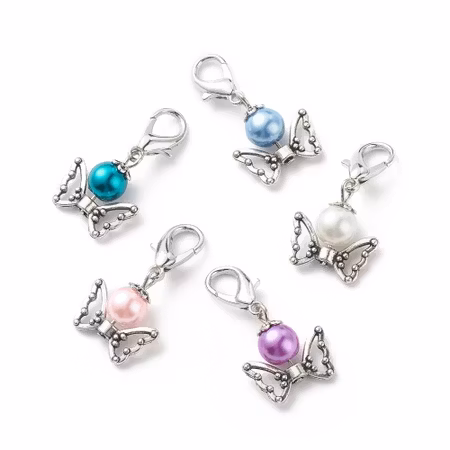 Charms - Berlock - vaxad glaspärla med vingar- antik silver/vit - 34mm