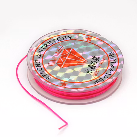 Färgad Elastisk nylontråd på rulle 0,6mm Djup rosa