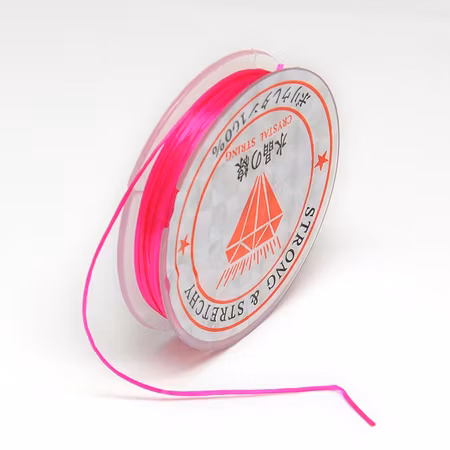 Färgad Elastisk nylontråd på rulle 0,6mm Djup rosa