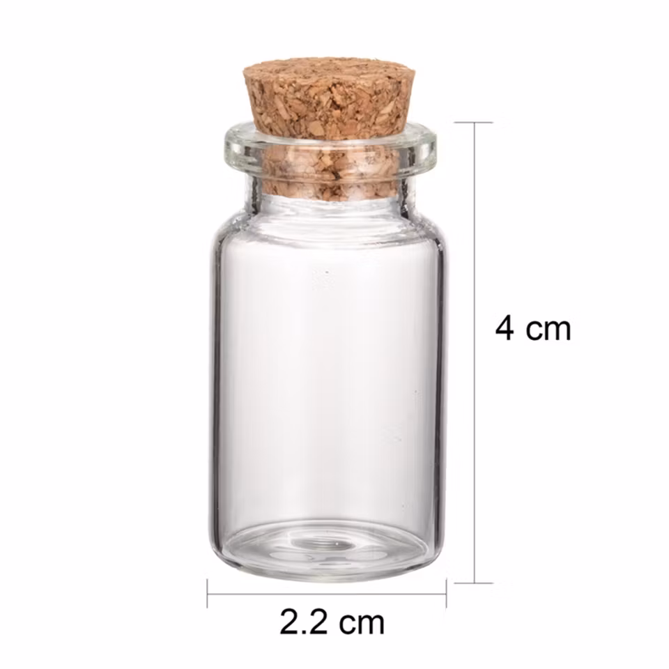 Liten glasflaska med kork