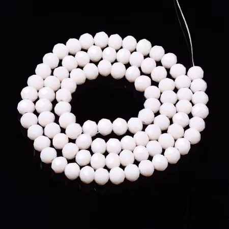 Facetterad glaspärla rondell - 6x5mm - creme vit - sträng - ca 90st