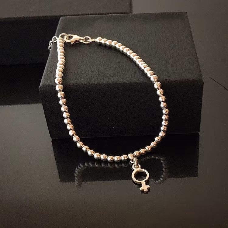 Venus - Armband med liten kvinnosymbol