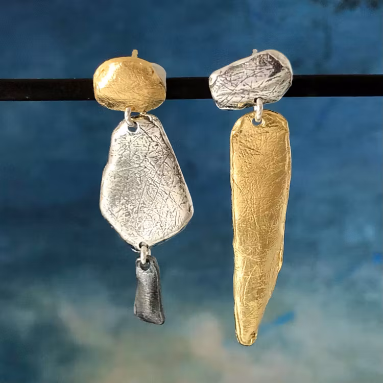 Novalie - Örhängen med skön design i silver, guld och svart