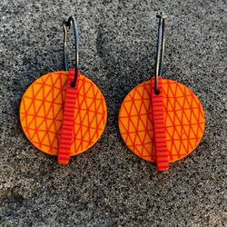 Ping - Orange örhängen i plexi och titan