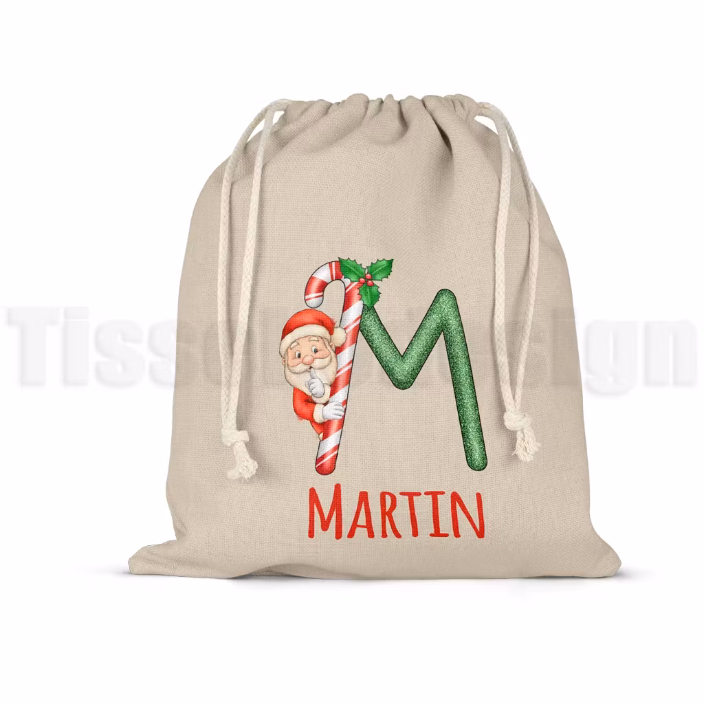 Julsäck med glittrig bokstav, tomte och plats för eget namn